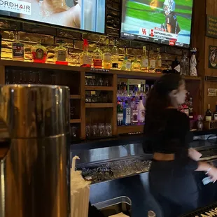 a woman behind the bar