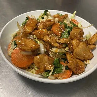 Teriyaki Chicken Marinated Chicken, carrots, onions, nappa cabbage and spinach toasted in a sweet teriyaki sauce.