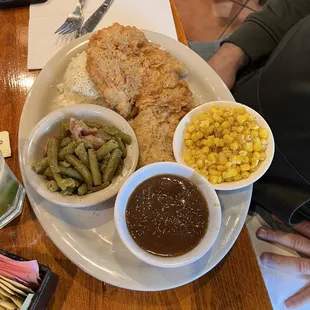 Chicken Fried Chicken with mashed potatoes, green beans, and corn