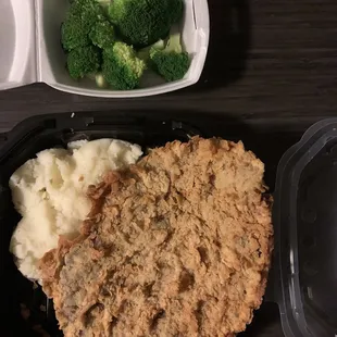 Chicken, fried steak, mashed potatoes, and broccoli