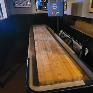a shuffle table in a bar