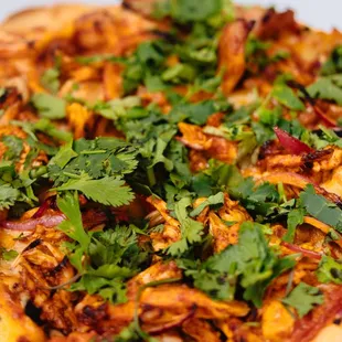 Tandoori Chicken Pizza
Shredded chicken, cilantro and onions marinated in tandoori masala.