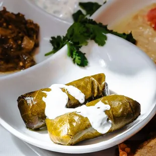 Dolma
Grape leaves filled with dill rice and topped with garlic yogurt sauce(vegetarian)