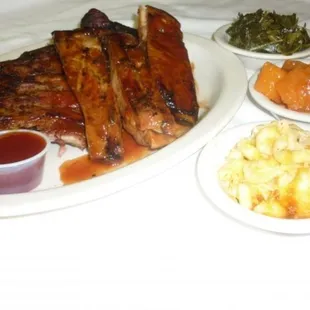 Ribs candied yams Mac n Cheese and collards