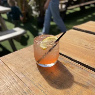 a drink on a picnic table