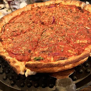 a deep dish pizza on a pizza pan