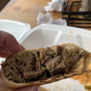 Beef Shawarma Sandwich with no parsley or tomato. Spicy pickles served with sandwich