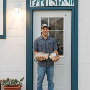 a man standing in front of a store