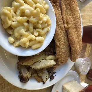 Catfish and fried potatoes with Mac and cheese and cornbread
