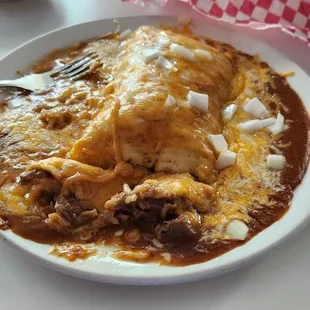 Carne "Guu-Lada".. Carne Guusada wrapped in a tortilla covered with chili con carne,cheese and onions....amazing