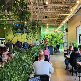 people sitting at tables in a restaurant