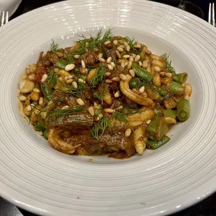 Braised lamb shoulder pasta - goat cheese cavatelli, spring vegetables, toasted pine nuts