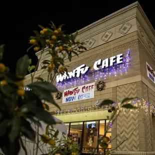 the front of the restaurant at night