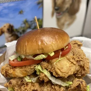 a chicken sandwich with lettuce and tomato