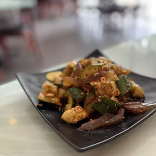 a plate of stir fried vegetables