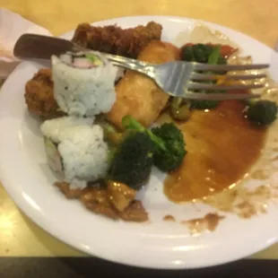 a plate of food with rice and broccoli