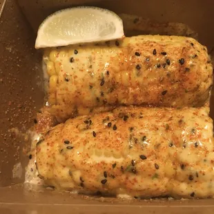 Corn on the cob with sesame aioli, cilantro, and togarashi.