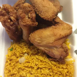 fried chicken and rice in a styrofoam container