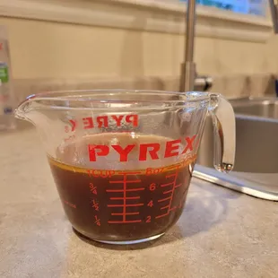 a glass measuring cup on a kitchen counter