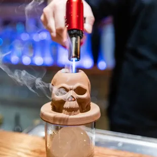 a person pouring a drink