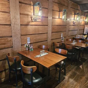 a dining area with wooden walls