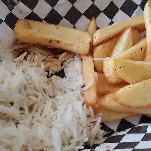 The rotisserie chicken came with a bit of rice and fries.