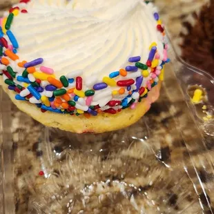 a cupcake with frosting and sprinkles