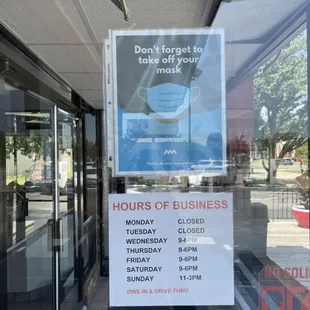 Sign on door reads "Don't forget to take off your mask"