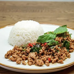 a plate of food with rice and meat