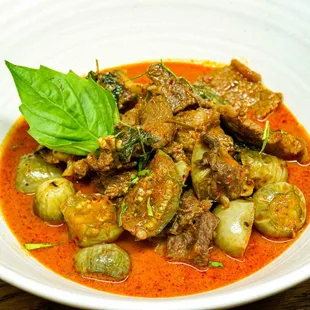 a bowl of stew with meat and vegetables