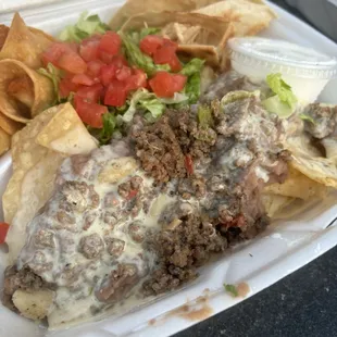 Small Wapo Botana  Chicken Quesadilla, chicken Flautas, beef Loaded Nachos