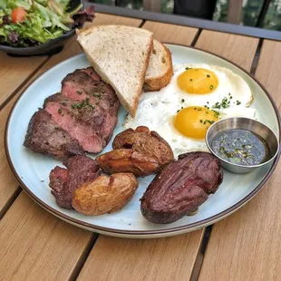 Steak &amp; Eggs with chimichurri sauce, herb smashed potatoes, toast, and salad