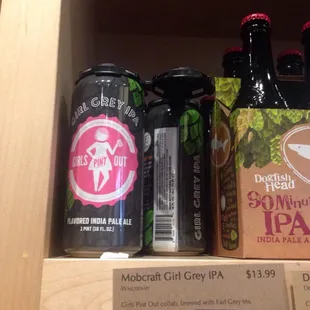 a variety of beers on a shelf