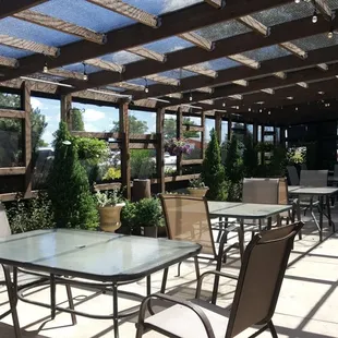 Ward&apos;s Garden Cafe has an outdoor patio decorated with lush plants and unique fountains to create a relaxing dining experience.