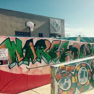 Outside artistic graffiti as you walk in.