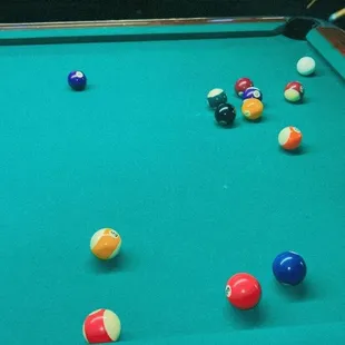 a pool table with balls on it