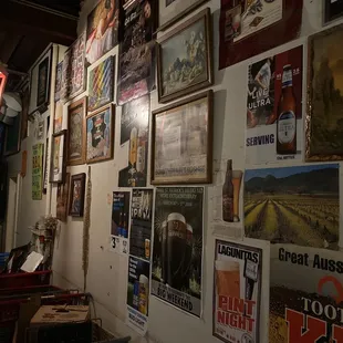 a wall full of beer posters