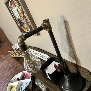 a glass of wine and a decanter on a table