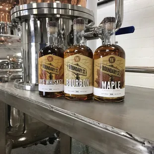 three bottles of bourbon on a table