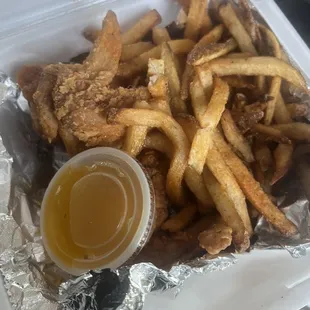 3 pc Wings/Fries with garlic Parmesan sauce. Don't let the photo fool ya. It's 3 wings under a mound of fries. A lot of yummy food for $5