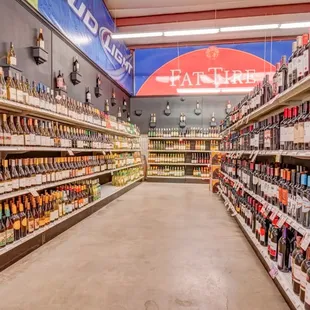 a wide aisle of liquor bottles