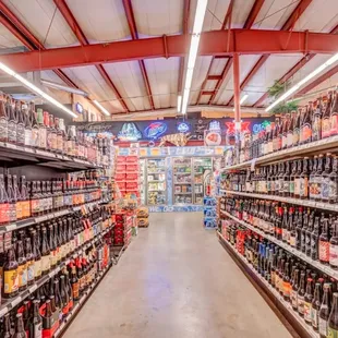 a wide aisle of beer bottles