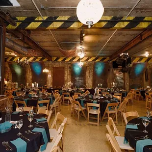 tables and chairs set for dinner