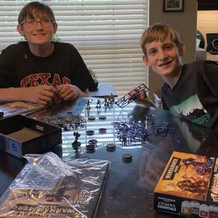 Kids are now Warhammer fans and putting together their first figures.