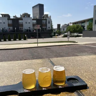 three glasses of beer on a tray