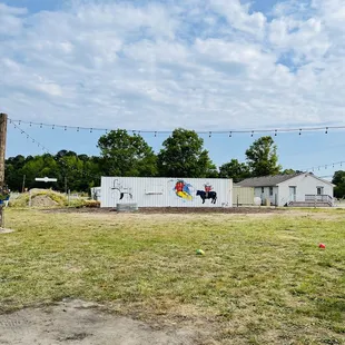 Field in the back of cabin for kids to run around