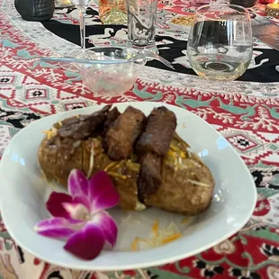 Loaded baked potato with steak