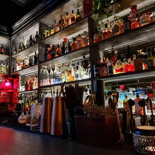 a bar filled with bottles of alcohol