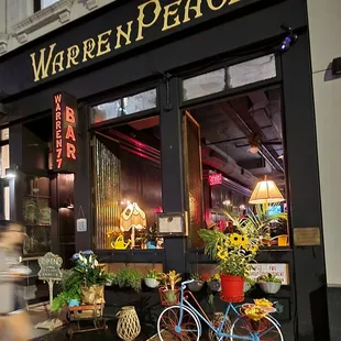 a bicycle parked in front of a restaurant