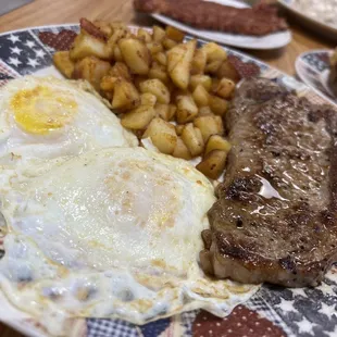 steak, eggs, potatoes and toast